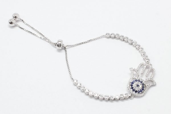 Pulsera de plata extensible con manito con cubic blanco y azules y una hilera de cubic a los lados